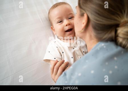 Close up portrait of a young mother and her newborn baby. Health care and medical, love woman lifestyle, mother's day concept. Stock Photo