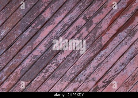 Texture from diagonal wooden boards with peeling paint. Stock Photo