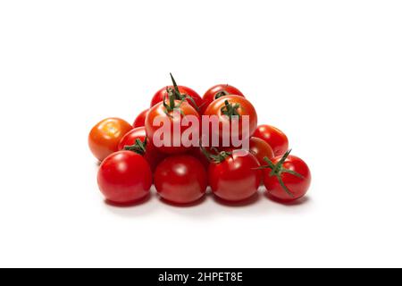 Many little cherry tomatoes isolated on  white background. Group of cherry tomatoes. Stock Photo