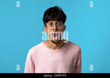 Amazed guy with eyes and mouth open looking at camera Stock Photo