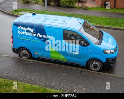 British Gas electric van with the strapline Keeping Bathtime Flowing parked on a suburban street, UK Stock Photo