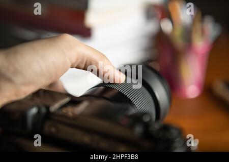 Manual focusing the camera lens Stock Photo