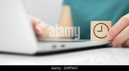 Temporary technical work, maintenance concept background. Computer repair, IT service. Office desk with laptop close-up view photo Stock Photo