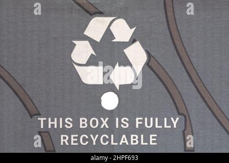 This box is fully recyclable with recycle logo recycling logo Mobius Loop symbol on box of flowers delivered by post Stock Photo