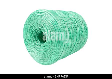 Coiled nylon rope isolated on white background. Green rolled  striped nylon rope isolated. A coil of new colored rope. Stock Photo