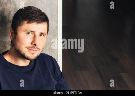 Handsome smiling bearded man at the office looking at the camera with copy space Stock Photo