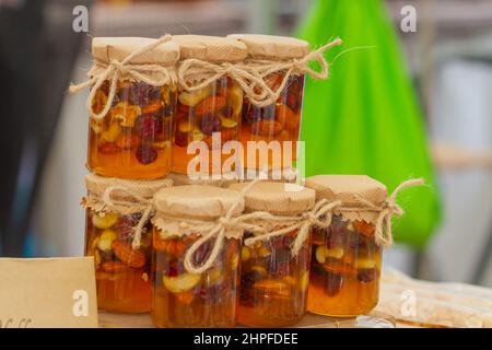 Honey jar with dried fruits stacked ready for consumption. Stock Photo