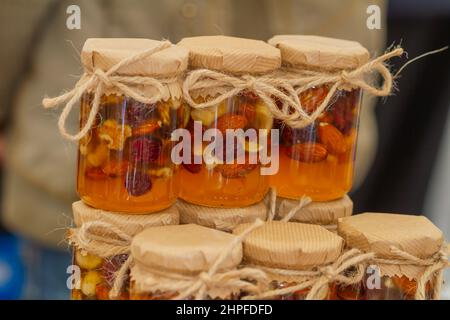Honey jar with dried fruits and nuts Stock Photo