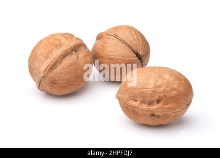 Three whole walnuts isolated on white Stock Photo