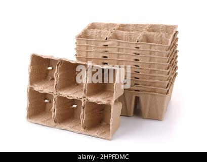 Biodegradable paper pulp peat seedling pots isolated on white Stock Photo
