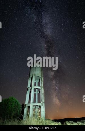 Rusty concrete water Tank under the stars Stock Photo