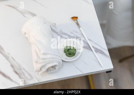 A green tea skin care facial at a local spa getting ready for use by a cosmetologist Stock Photo