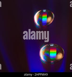 Shiny raibow colored water drops on the old compact CD disc, design for background Stock Photo