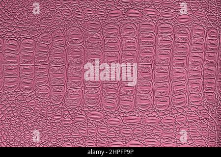 Pink crocodile leather texture. Abstract background for design. Stock Photo
