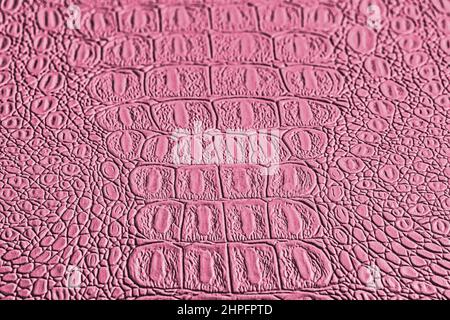 Pink crocodile leather texture. Abstract background for design. Stock Photo