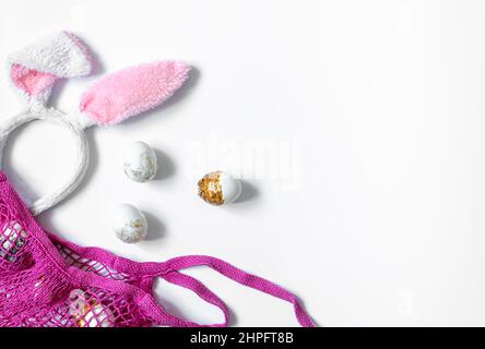 Festive Easter background with eggs and string bag, copy space. Stock Photo