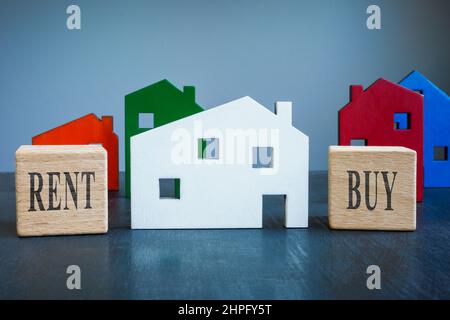 Wooden house with cubes buy or rent for real estate. Stock Photo
