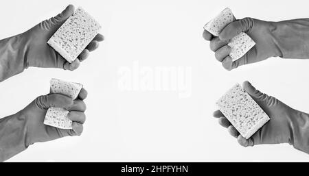 Black and white hands in rubber gloves with cleaning sponges on light background. Space for your text Stock Photo