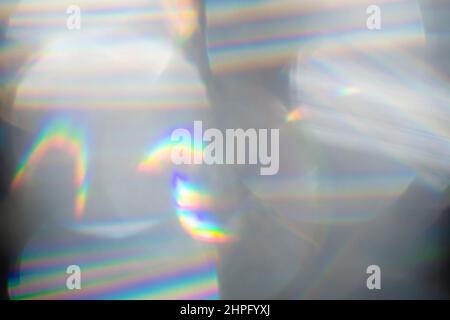 Rainbow Lens. Optical glare effect of objective lenses. Defocused blur reflection of rainbow sunbeams. Stock Photo