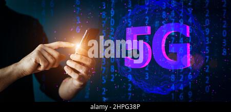 5g connect telecom banner background. Phone in hand on the background of a computer network and data. Technology, communication, connection concept. High quality photo Stock Photo