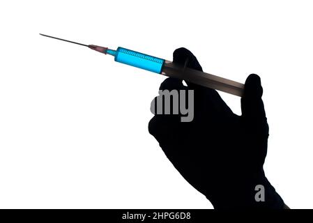 Silhouette of a hand with syringe filled with blue liquid, isolated on white background. Vaccination concept. Stock Photo