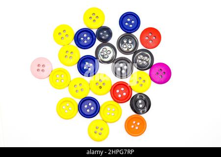 Lots of bright scattered colored buttons on a white background. Stock Photo