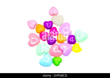 Accessories for needlework form of bright colored hearts on a white background. Stock Photo