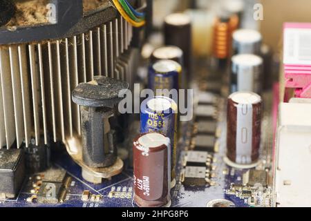 Old computer system unit with spider web and dust inside. Stock Photo