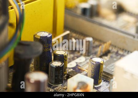 Old computer system unit with spider web and dust inside. Stock Photo