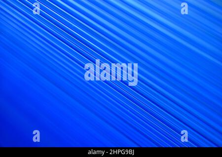 Blue bright stripes of polycarbonate in the light Stock Photo