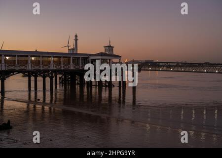 Gravesend town pier at Gravesend Kent at sunset with the docks at ...