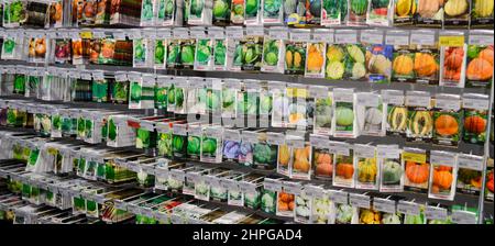 Moscow, Russia, December 2019: Close-up of a stand with paper bags with seeds of vegetables: pumpkins, cabbages. Sale in the store. Stock Photo