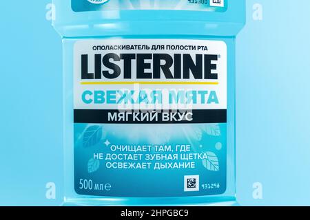 Tyumen, Russia-February 06, 2022: Listerine fresh mint is a brand of antiseptic mouthwash product, blue background Stock Photo