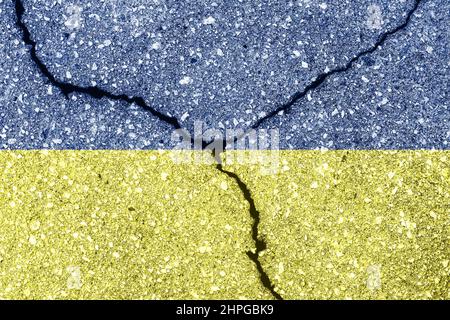 Ukrainian flag on cracked concrete wall. The concept of crisis, default, economic collapse, pandemic, conflict, terrorism or other problems in the cou Stock Photo