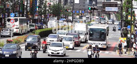 traffic in main street , Shinjuku, Tokyo Stock Photo