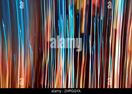 Abstract vertical lines artistically created with colored christmas lights lights. Long exposure. Light painting Stock Photo