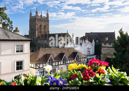 Great Malvern Priory and a view of flowers and rooftops in Great Malvern, an area of the spa town of Malvern, Worcestershire, England Stock Photo