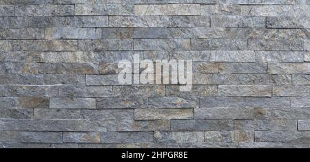 Texture on the gray wall of decorative stone in the house Stock Photo