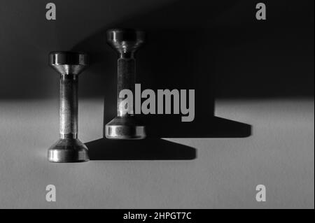 Close up of dumbbells on grey backgound. Sport and fitness equipment. Horizontal sport poster, greeting cards, headers, website. Stock Photo