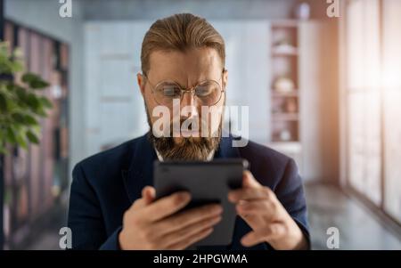 Man with tablet at office Stock Photo