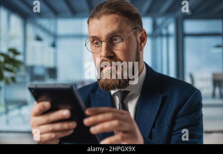 Businessman with tablet at office Stock Photo