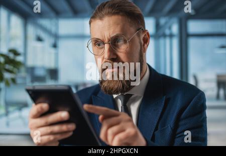Man with tablet at office Stock Photo