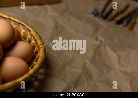 Rustic Easter background. Tools for decorating Paschal eggs, Pysankas. Collection of eggs. Homemade pen for drawing eggs. Preparation for holiday. Cra Stock Photo