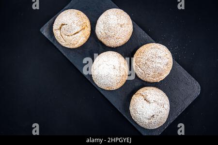 Appetizing Shu cakes on a black background. Stock Photo