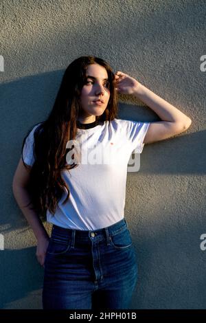 Young sad girl retro, 70s, 80s fashion style clothes, vintage outfit posing  isolated on white background. Concept of art, fashion, beauty, emotions  Stock Photo - Alamy