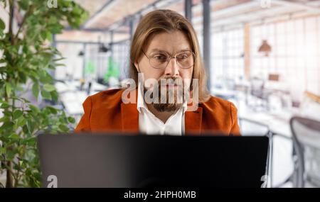 Man with laptop at office Stock Photo