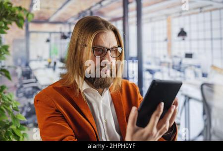 Man using tablet at office Stock Photo