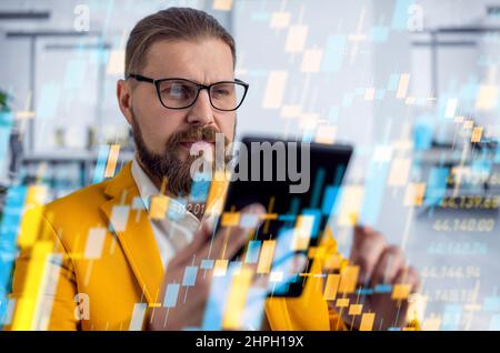 Crypto trader using tablet Stock Photo