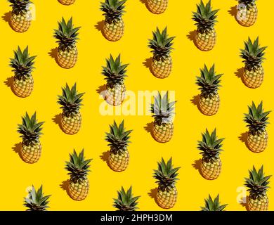 Pineapple pattern on yellow background Stock Photo