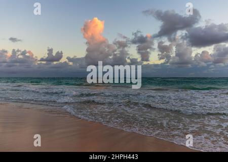 Atlantic ocean coast of Haiti island. Landscape with dramatic cloudy sky on a sunrise, Dominican republic. Bavaro beach Stock Photo